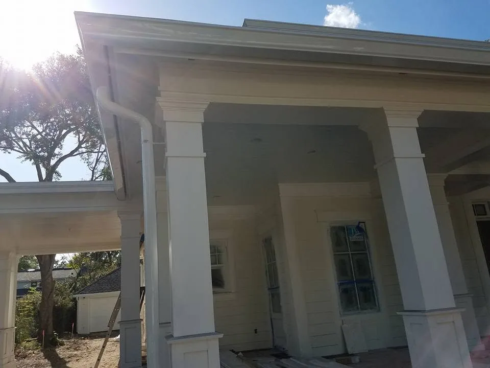 Craftsman porch tapered columns round downspout sun flare, Lake Monroe